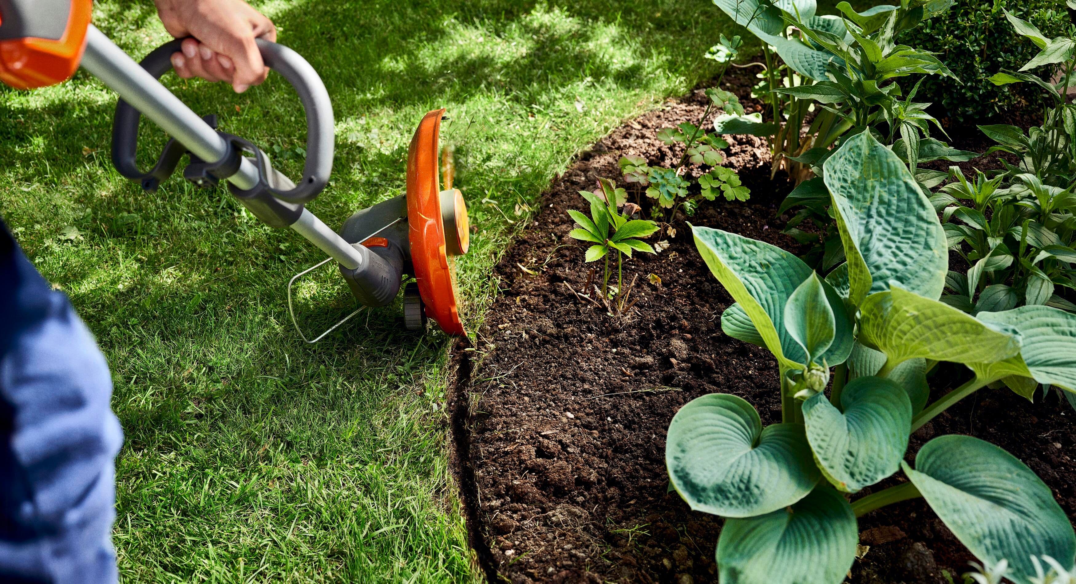 man wearing ppe with chainsaw